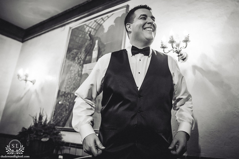 smiling groom getting ready at Fabulous Fox Theater St Louis wedding