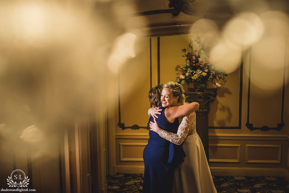 bride and mother hugging at Fabulous Fox Theater St Louis wedding