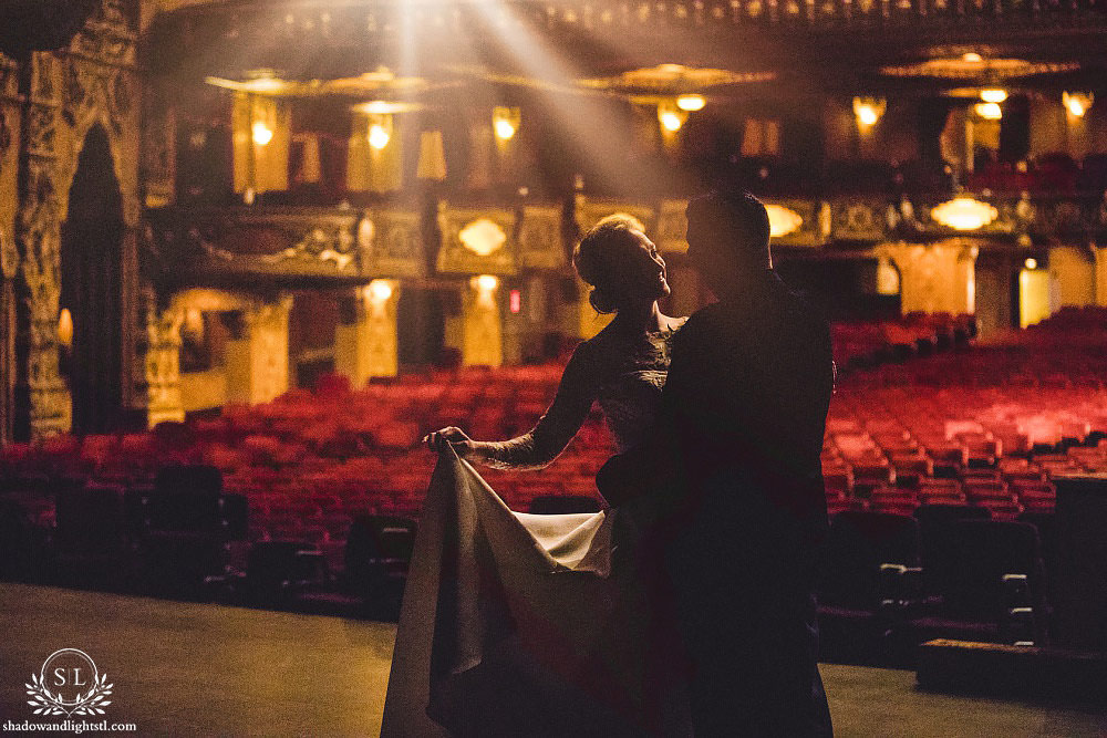 bride and groom on stage at Fabulous Fox Theater St Louis wedding