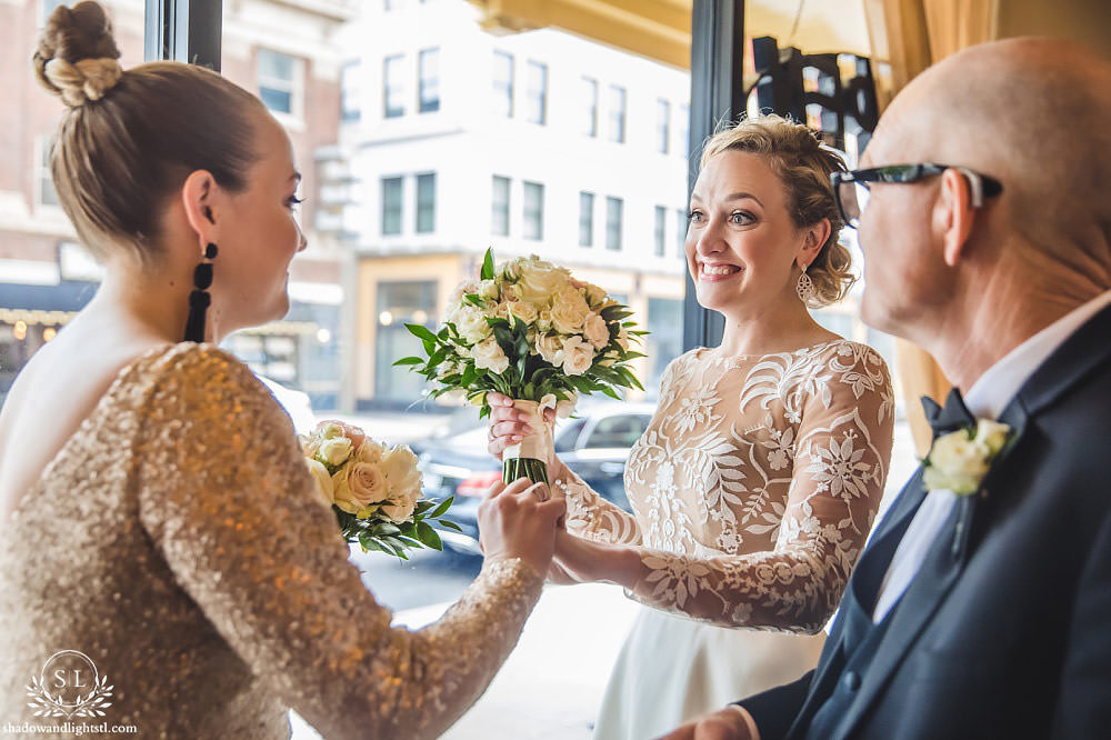 bride and sister at Fabulous Fox Theater St Louis wedding