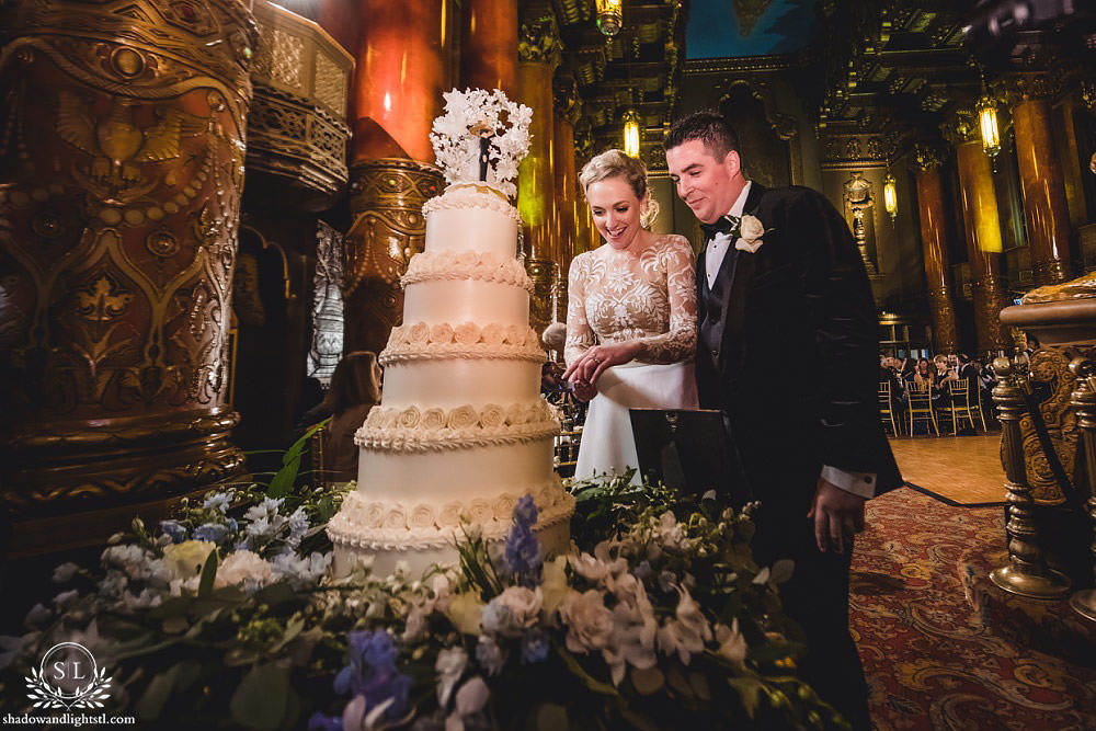 cake cutting at Fabulous Fox Theater St Louis wedding