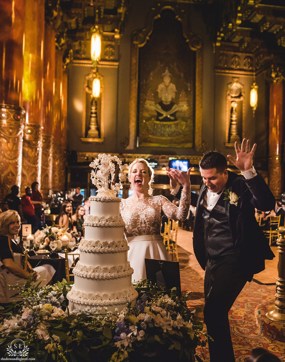 cake cutting at Fabulous Fox Theater St Louis wedding