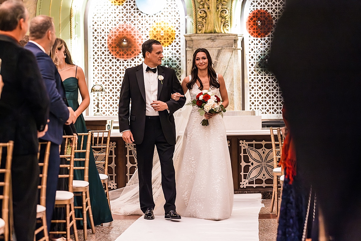 father and bride walking down in beautiful St. Louis Union Station wedding photo