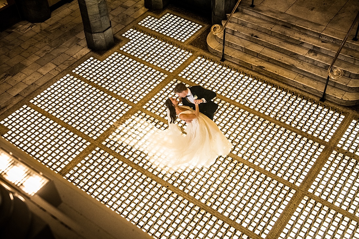 bride and groom dancing and dipping in beautiful St. Louis Union Station wedding photo