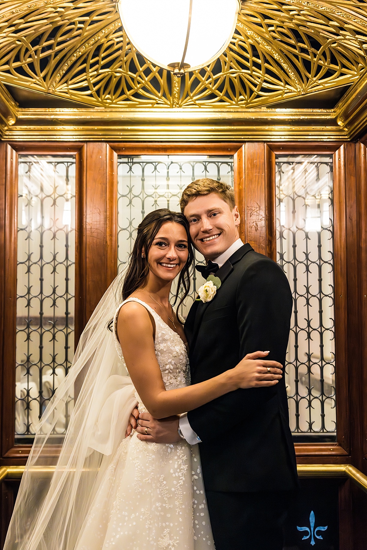 bride and groom in elevator in beautiful St. Louis Union Station wedding photo